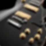 Close-up of the Epiphone Les Paul Electric Guitar in ebony finish showcasing its sleek design and craftsmanship.