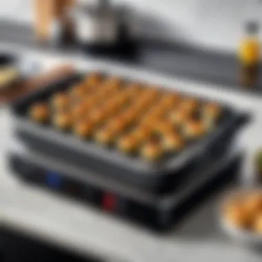 A modern electric takoyaki grill maker in a contemporary kitchen setting.