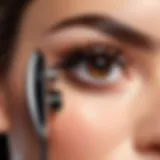 Close-up of a sleek rechargeable eyelash curler showcasing its modern design and functionality.